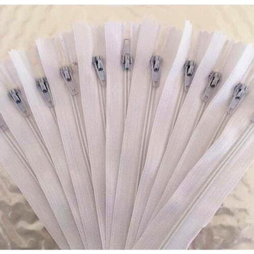 10 pieces. 55cm (22inch) White nylon coil, zipper, tailor, crafter and fgdqrs