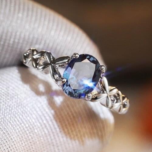 Huitan Romantic Solitaire Blue Oval CZ Ring for Women with Fancy Cross Twine Design Wedding Anniversary Party Fashion Jewelry