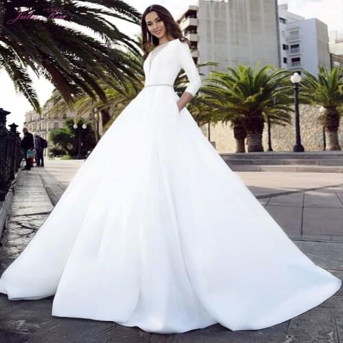 Julia Kui Luxurious Satin Princess A- Line Wedding Dress With Illusion V-neck And Beaded Sashes