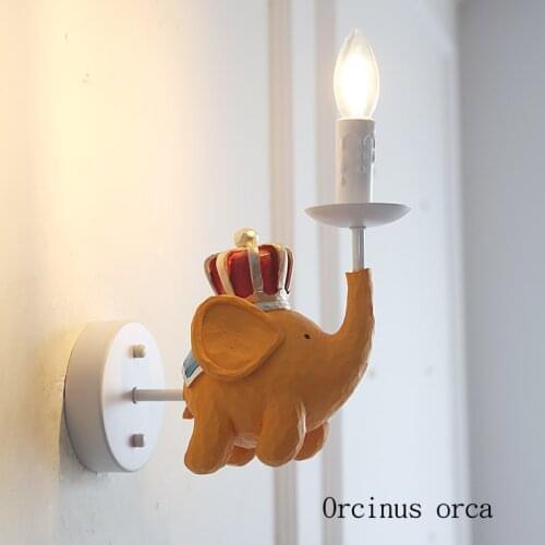 Cartoon creativity flying elephant wall lamp childrens room bedroom bedside lamp American modern simple LED animal wall lamp