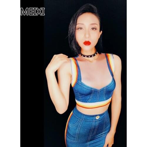 A blue denim dress with rainbow stripes serves as a jumpsuit for nightclub singers and dancers