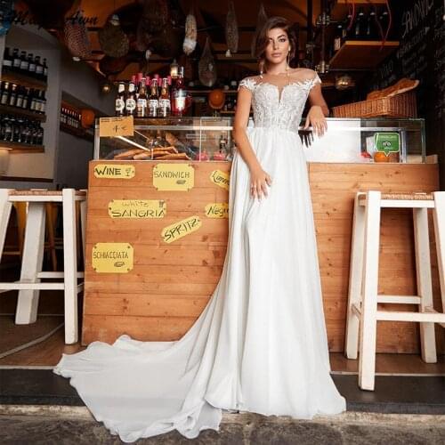 Magic Awn Bohemian Lace Chiffon Wedding Dresses O-Neck Cap Sleeve Illusion Princess Beach A-Line Bridal Gowns Vestido De Novia