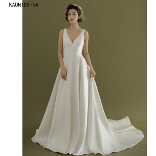 KAUNISSINA Charming White Wedding Dresses Deep V-Neck Backless Sexy Satin Bridal Dress A-Line Sweep Train Bride Wedding Gowns
