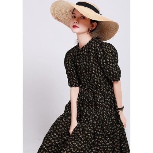 In the summer of 2021, the new yellow floral dress is a long dress with womens over-the-knee bubble sleeves