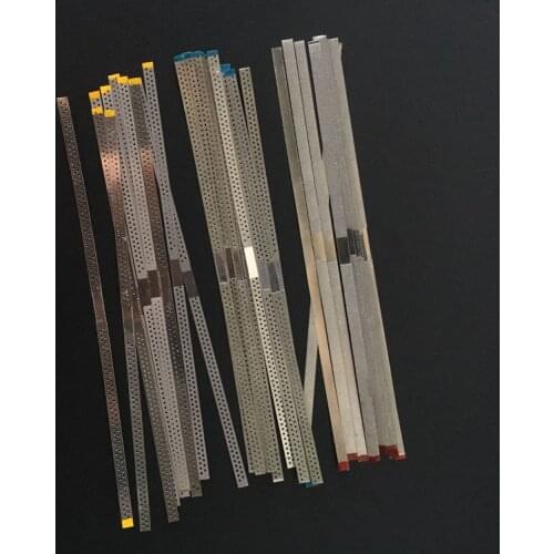 Orthodontic single-sided and double-sided emery strips Polished adjacent surfaces and open interdental emery strips