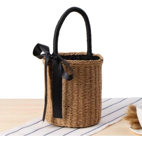 New cylinder hand carry straw bag national wind summer vacation woven bag portable bucket ribbon casual beach bag