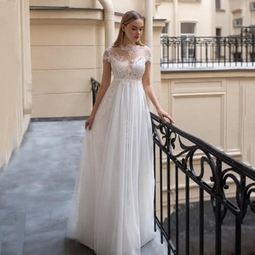 2021 New Arrival High Neck Short Sleeve Lace Applqiue Pearls Buttons Tulle Wedding Dress 2021 Vestido De Noiva Bridal Gowns