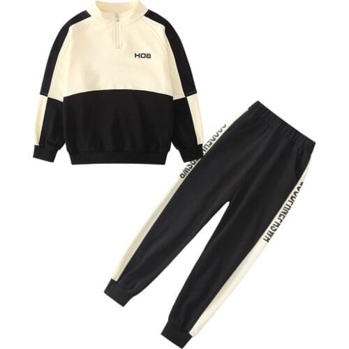 Kids girls leisure suit spring / autumn spell color long-sleeved sweater coat + pants 2pcs sets of new big virgin suit