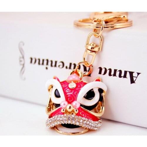 Creative Chinese style lion head car keychain oil drop craft small gift metal pendant key ring bag pendant mascot