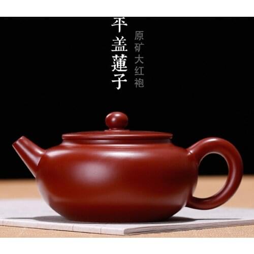 Undressed ore authentic dahongpao flat cover lotus seed pure manual wholesale custom a undertakes the teapot