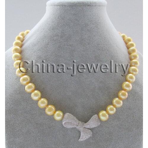 P7341-18" 10-11mm natural gold round freshwater pearl necklace - Bowknot pendant