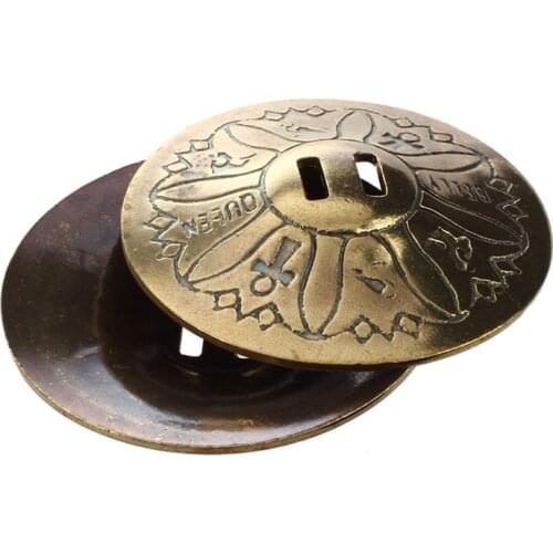 For the belly dance, pair of finger cymbals, in copper, gilded