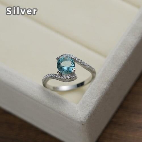 Hot sales in Europe and the fashion 925 sterling silver stagger platinum ring character zircon ms sky blue round crystal jewelry