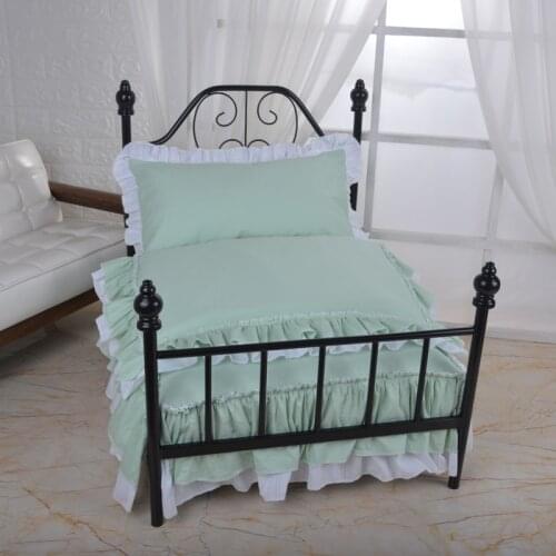 High-grade pet iron bed with mint green bedding
