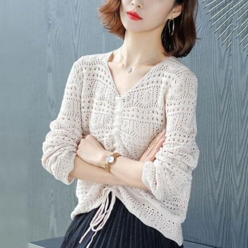 Womens spring and autumn hollow knit top Korean version of solid color V-neck thin drawstring long-sleeved sweater plus size
