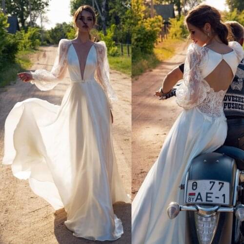 2020 A Line Wedding Dresses Sexy Deep V Neck Lace Draped Bridal Gowns Long Sleeve Hollow Back Sweep Train Beach Wedding Dress