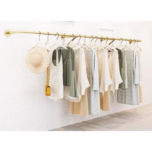 Clothes hanger on the wall of clothing store display rack special clothes hanger for womens clothing store childrens clothing