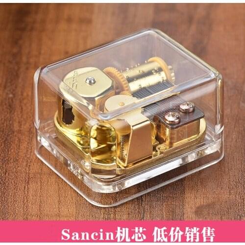 Transparent gold-plated spring movement acrylic square music box creative gift eight sound box home furnishings home decoration