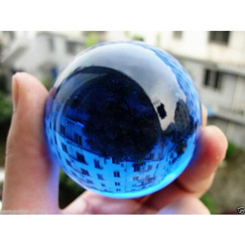 The hot 60MM blue glow white jade glows in the dark stone ball