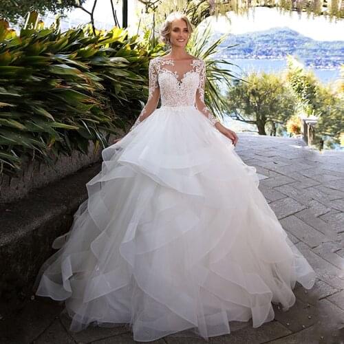 Ashley Carol Tulle Wedding Dresses 2021 Long Sleeves Sweetheart Illusion Sexy Backless Bridal Dress Princess Ruffles Bride Gowns