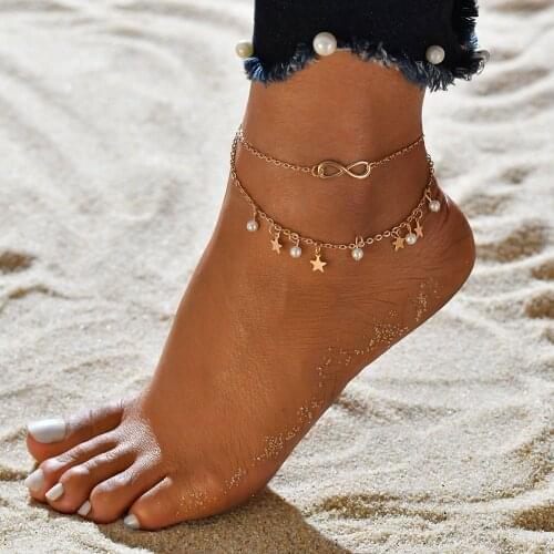 Beach anklets with stars and faux pearl pendant in gold tone