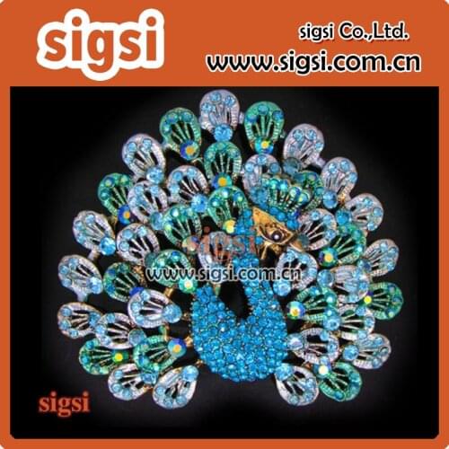 Showy peacock rhinestone brooch