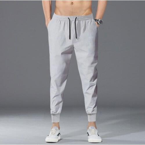 New Sports Mens Nine-point Pants Korean Ice Silk Casual Pants Solid Color Quick-drying Four-sided Stretch Pants