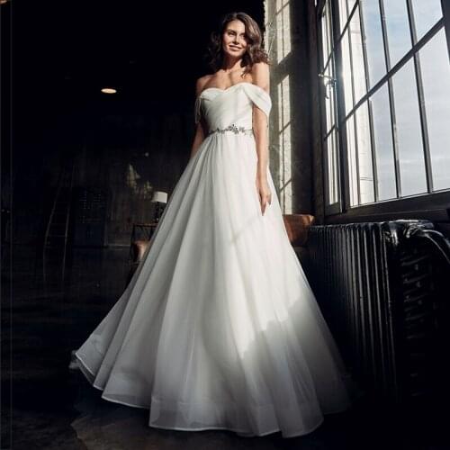 Modest Off-the-shoudler A-line Wedding Gowns 2021 Beading Sweep Train Organza Strapless Bridal Dresses with Pleats
