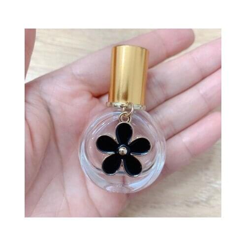 10pcs/lot 10ml 12ml 15ml Perfume Roll on Bottle with Flower pendant Ball Roller Essential Oil Vials Thin Glass
