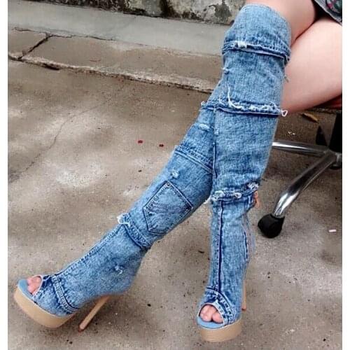 Fashionable attractive light blue denim shoes woman with sexy modern patch tassels design peep toe sky-high long platform boots