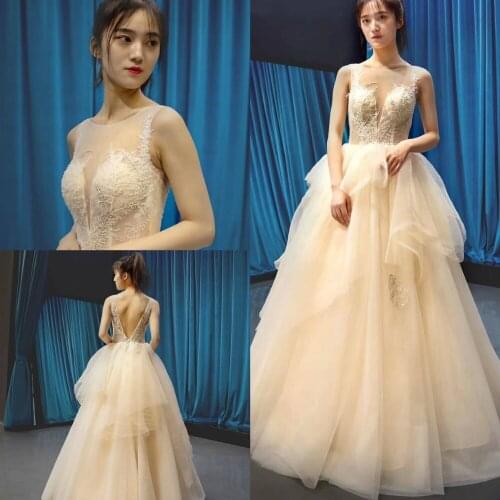 2019 New Champagne Evening Dresses Jewel Sleeveless Lace Appliques Prom Gowns Dubai Arabic Sexy Backless A Line Party Dress