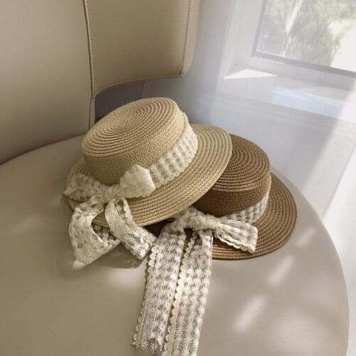 2021 Korean spring and summer baby travel flat top big edge sun hat sun hat small fresh lace bow boys and girls straw hat