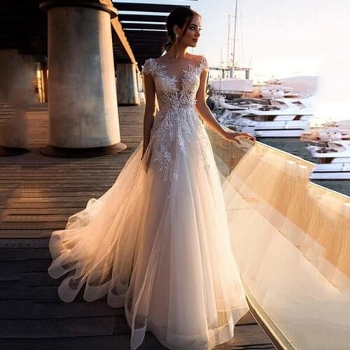 Beautiful Champagne Tulle Wedding Dresses Cap Sleeve A-Line Appliques Illusion Back Bridal Gowns
