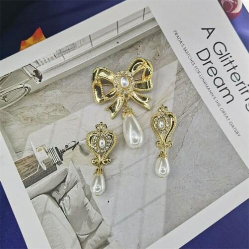 Boundary bow brooch earrings earrings joker temperament and exposed brooch pearl accessories