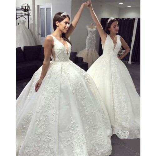 Elegant Design Plunging V Neck Appliqued Beaded Sleeveless Low Back Pleated Ball Gown Sweep Train Wedding Dresses