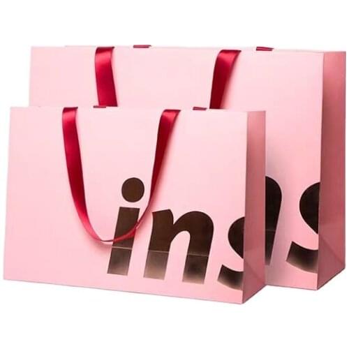 Custom branded luxury pink paper bag with ribbon handle shirt jeans jackets apparel packaging paper bag for clothes