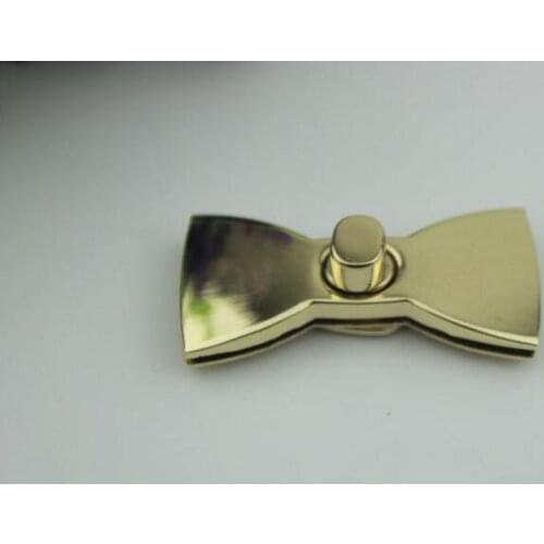 50pcs/lot pale golden handbags hardware accessories die casting twist lock the butterfly lock tie knot lock Rotate the lock