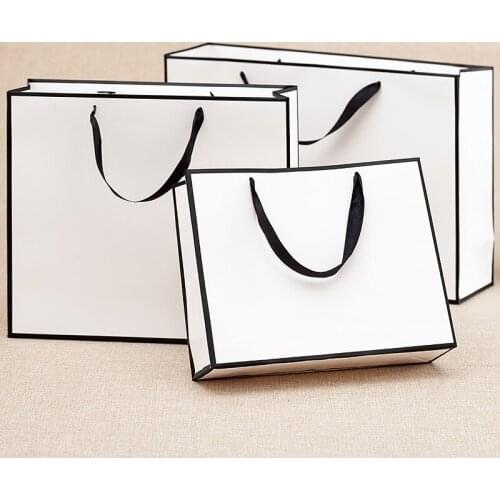 Custom printed kraft paper bags plain garment bag with ribbon stain waterproof paper bag reusable