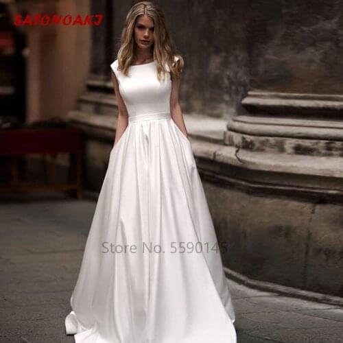 2020 New Satin Wedding Dress Sheer Sexy V-Back Cap Sleeve With Pockets Sashes Bridal Gown Vestido De Novia Online Shop Undefined