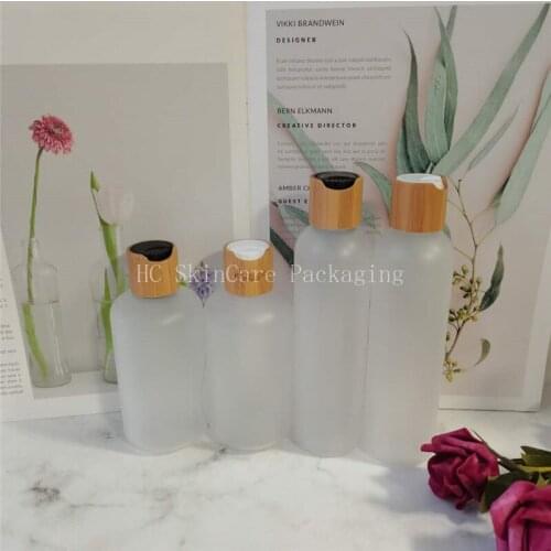 Bamboo cosmetic bottles 250ml Empty frosted plastic bottle with bamboo cap disc top lotion bottles for toner water