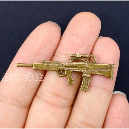 30pcs- Antique Bronze 2 Sided Machine Gun Charm Pendant 45x18mm