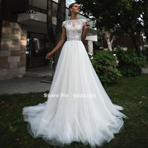 Sexy Lace A-Line Wedding Dresses O Neck Cap Sleeve Appliques 2021 New Floor Length Bridal Gown Robe De Mariée Vestidos Sukienki