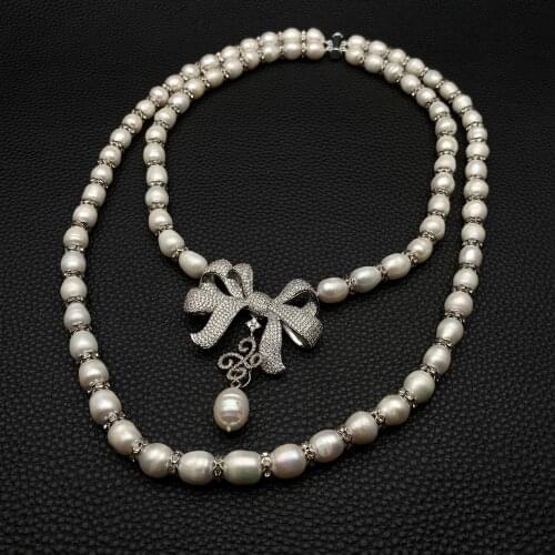 YYGEM 2 Strands Freshwater Cultured White Rice Pearl Necklace Bowknot Cubic Zirconia Pave Pendant 18"