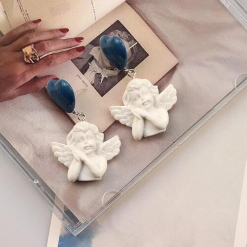 Haze blue silver pin stud earrings angel retro European and American earrings baroque style female earrings new ear clips