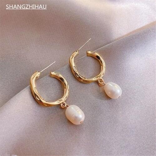 Classic geometric gold stud earrings with natural pearl pendant earrings for women with luxury unusual jewelry accessories