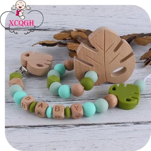 XCQGH 2Pcs/set Personlized Leaf Beech Wooden Teether Silicone Beads Baby Pacifier Nipple Holder Clip and Teether Bracelet