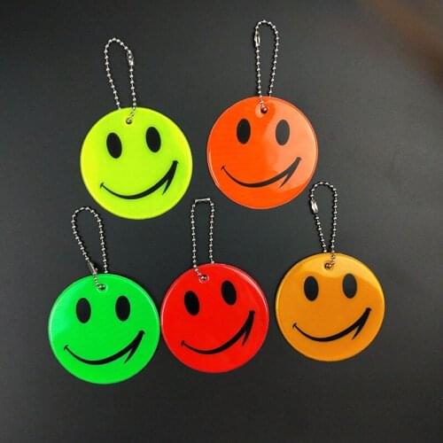 Wholesale 100pcs smile face Reflective keychain bag pendant accessories High visibility keyrings for traffic visible safety use