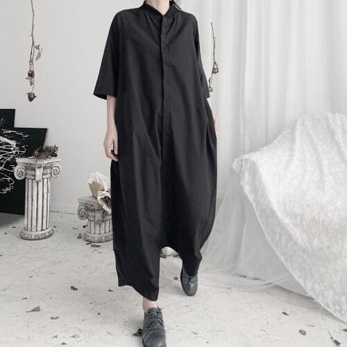 Yamamoto, dark avant garde, niche designer Yoji, walking down the runway in a flying mouse jumpsuit