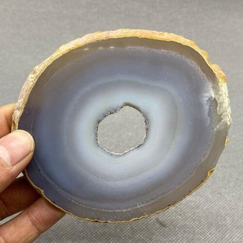 Natural agate slice polished ore specimen with crystal hole