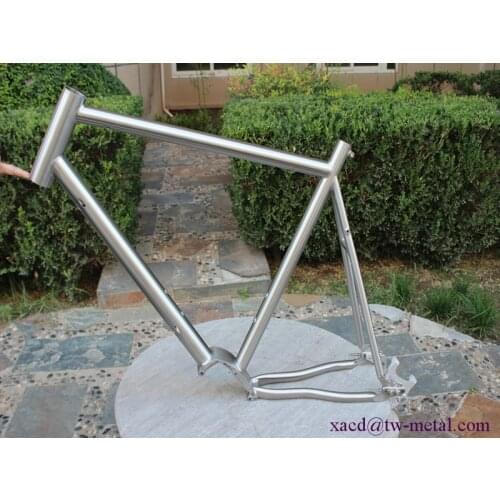 Titanium pinion stand bike frame with integrated head tube sliding thru axle dropouts